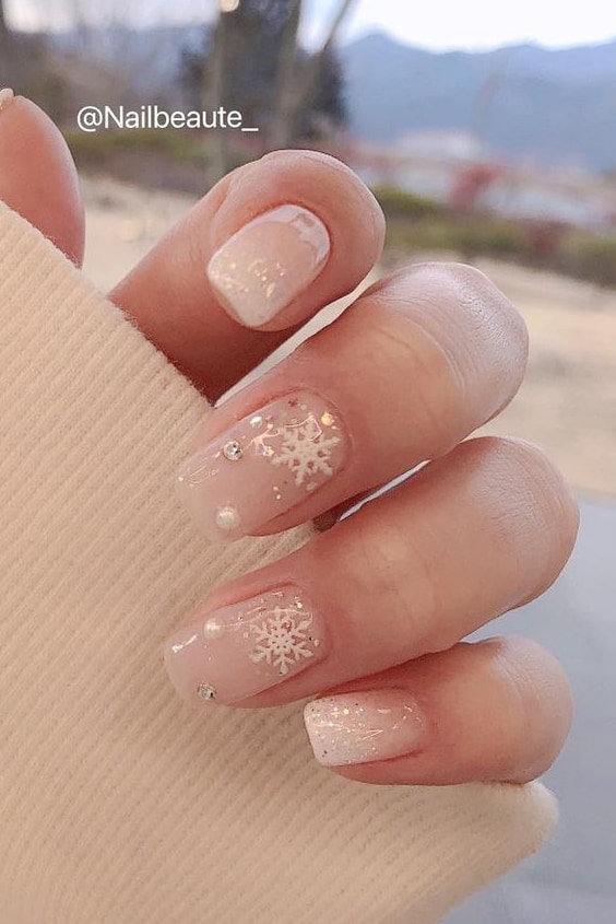 Pink Nails with Snowflakes Designs