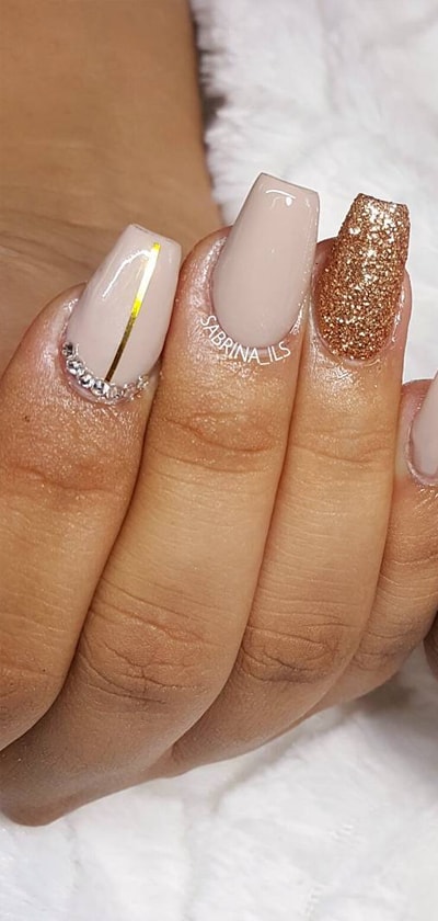Nude And Gold Glitters Nails Plus Gold Stripe