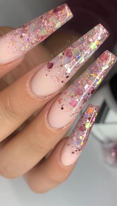 These ombre nails are perfect for any occasion and can't go wrong! From a disco ball, galaxy nails, to a winter wonderland look these designs will make your nails stand out from the crowd. #glitterombrenails #glitterombreailart #glitterombrenaildesigns #glitterombreacrylicnails