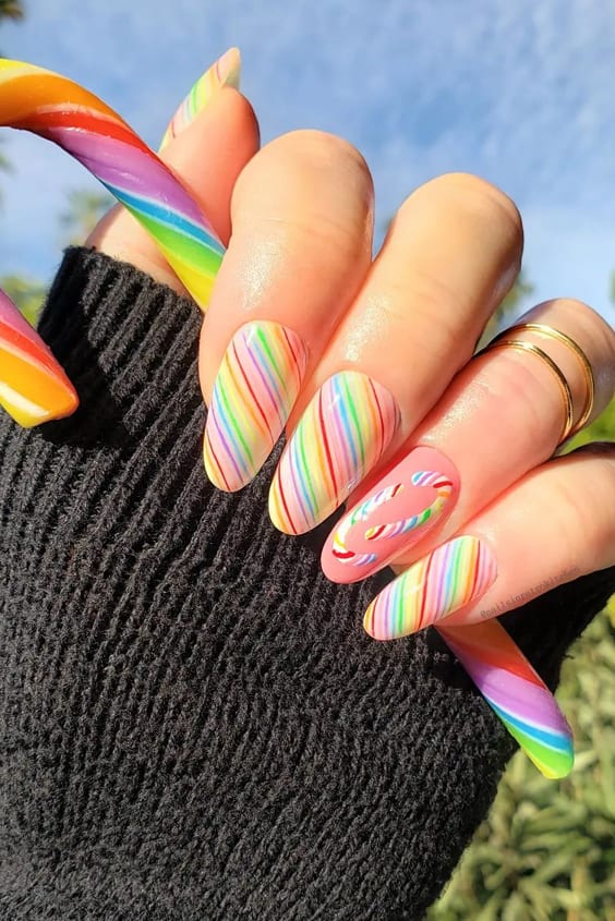 Nail art is not just a trend. It's a way of expressing yourself and embracing your creativity. In this blog post, you'll see 24 different nail designs that will make you smile. You'll learn how to create each design with the right tools and materials so that it's easier for you to try them out at home! #rainbownails #rainbownailart #rainbownaildesigns #rainbowacrylicnails