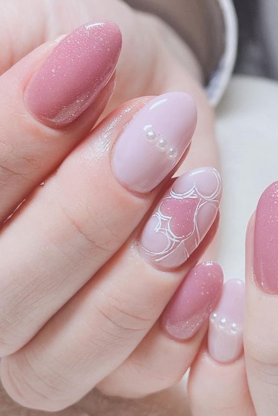 Soft Pink Almond Nails with Heart Design