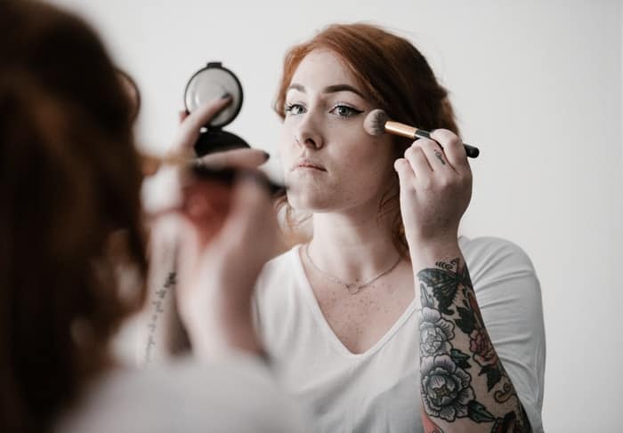 woman using makeup