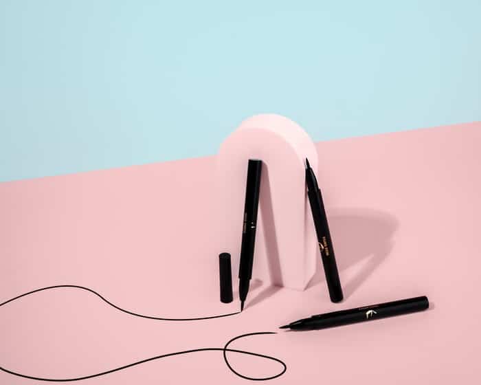 black and white wireless headphones on white table