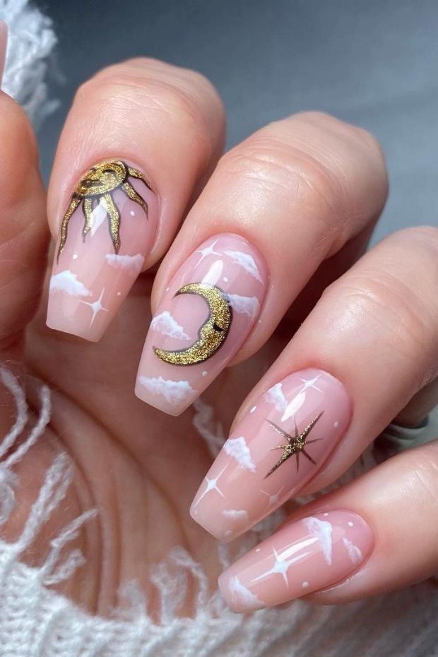 Embracing the celestial beauty with these sun and moon nails, a golden touch to add sparkle to my day