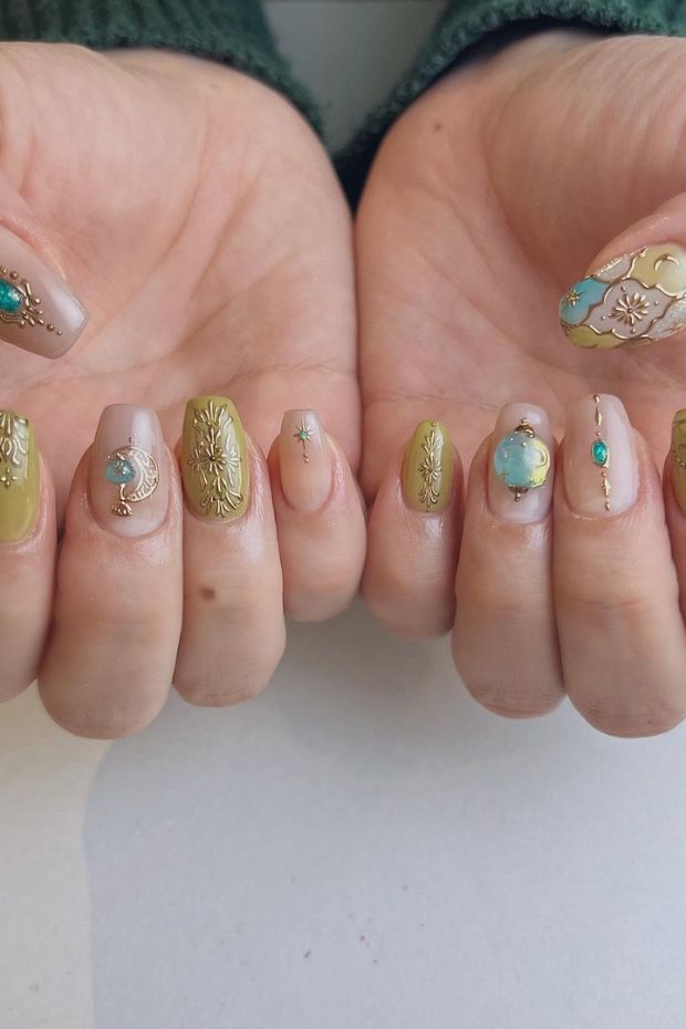 Shining brightness and celestial charm with these gold sun and moon nail inspirations. Embrace the cosmic beauty of your fingertips!