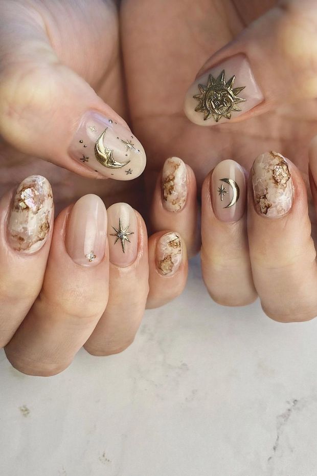 Embracing celestial vibes with this stunning gold sun and moon nail art. Adding a touch of cosmic elegance to my everyday look