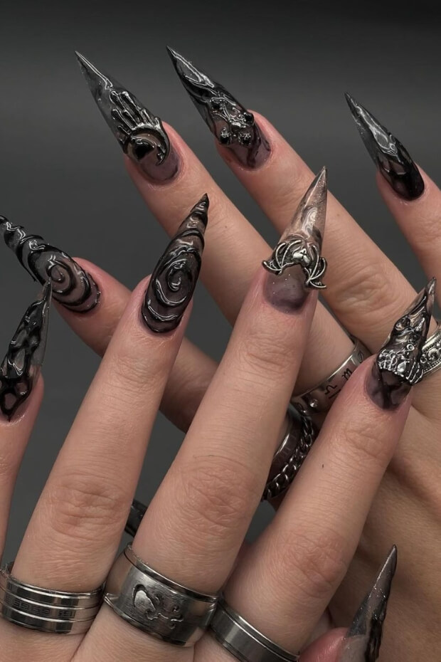 Intricate Black and Silver Gothic-inspired Stiletto Nail