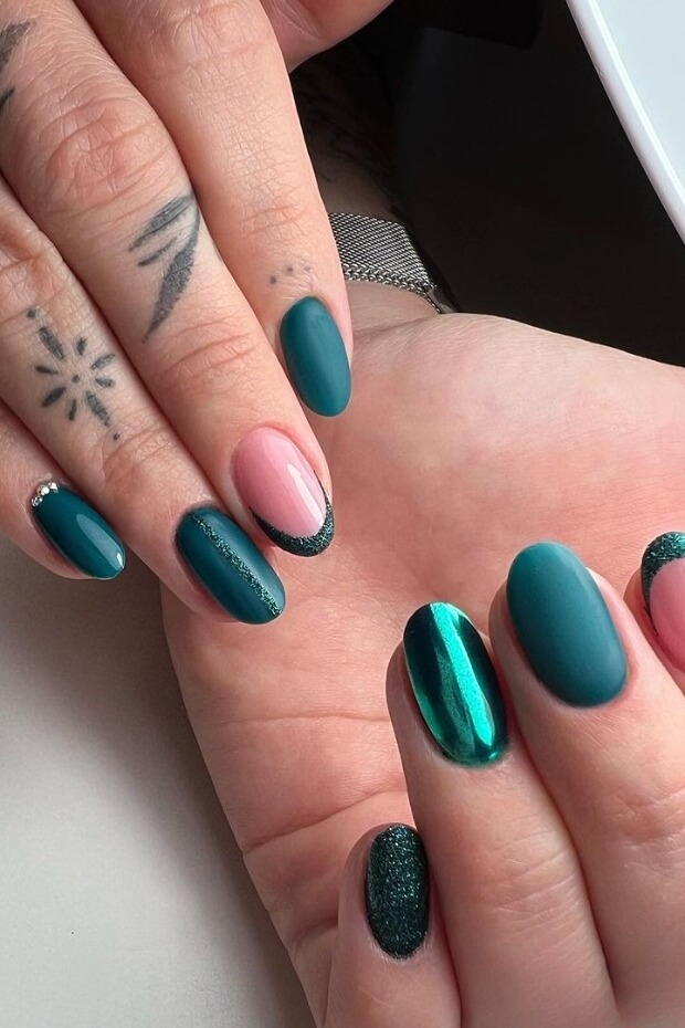 Emerald green and pink nail design with metallic accents