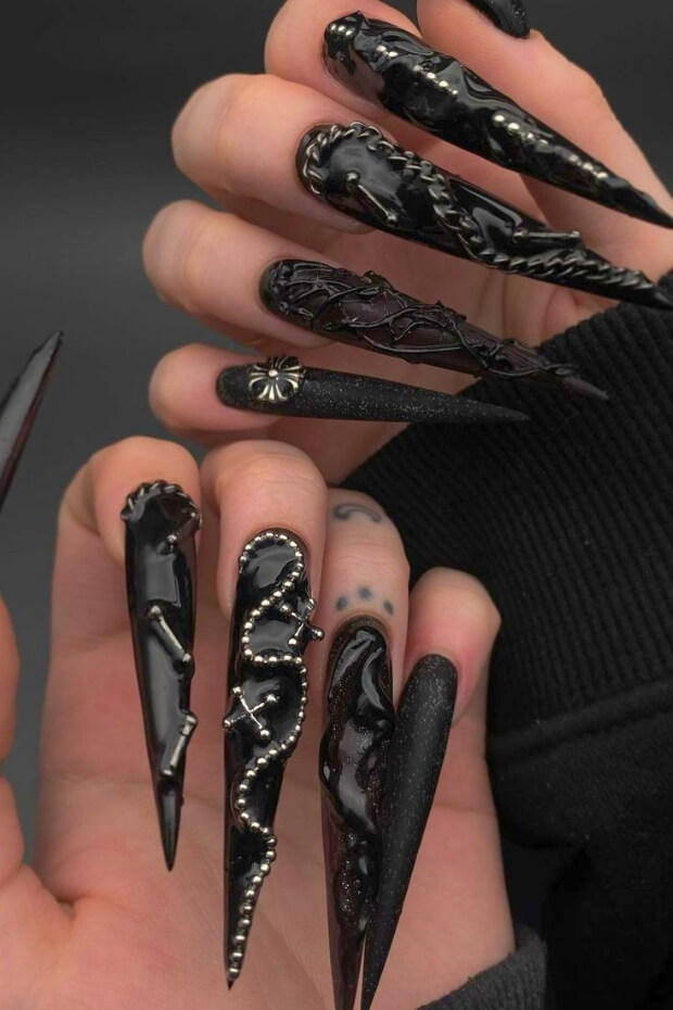 Stiletto Goth Nails with Dark Colors and Silver Accents