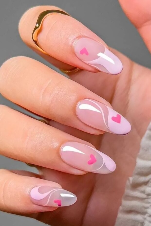 Pink hearts on clear almond nail