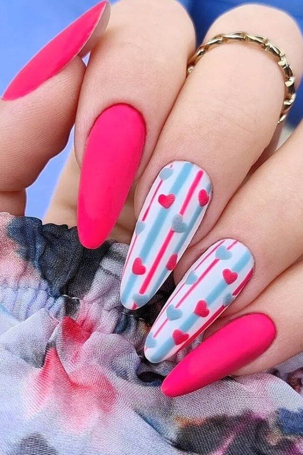 Pink and blue heart pattern on nails