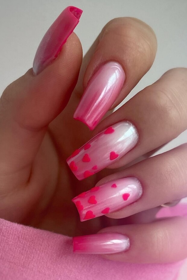 Pink and white heart nail art design