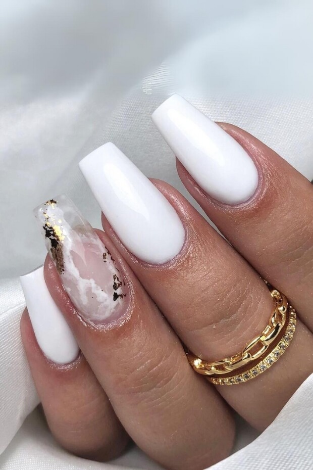 White marble nail design with gold accents