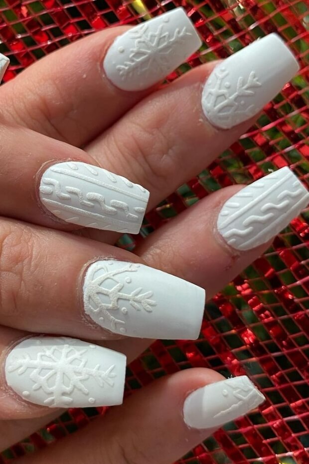 White nail art with snowflake pattern