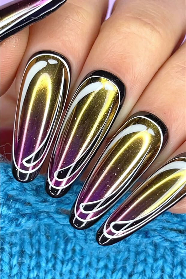 Black and gold metallic chrome nail design