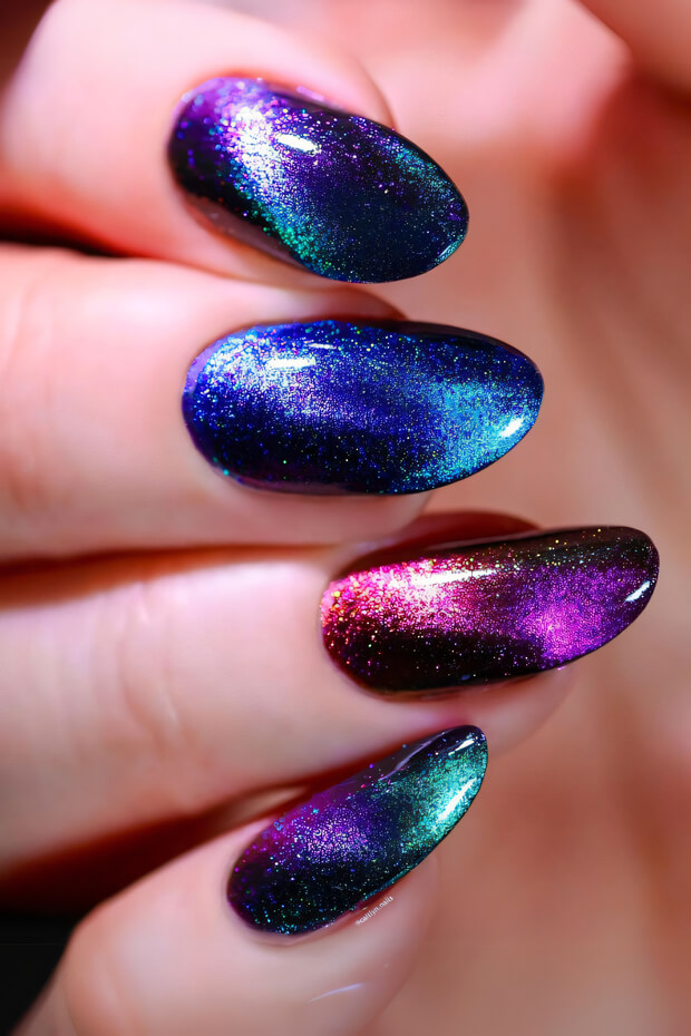 Sparkly and glittery nail art with purple, blue, and green colors