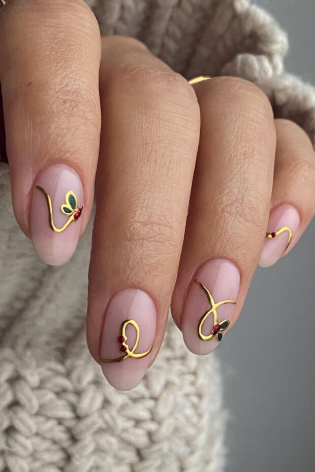 Gold wavy lines with pink background nail art design
