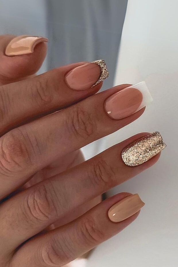 Gold and white glittery nail art design