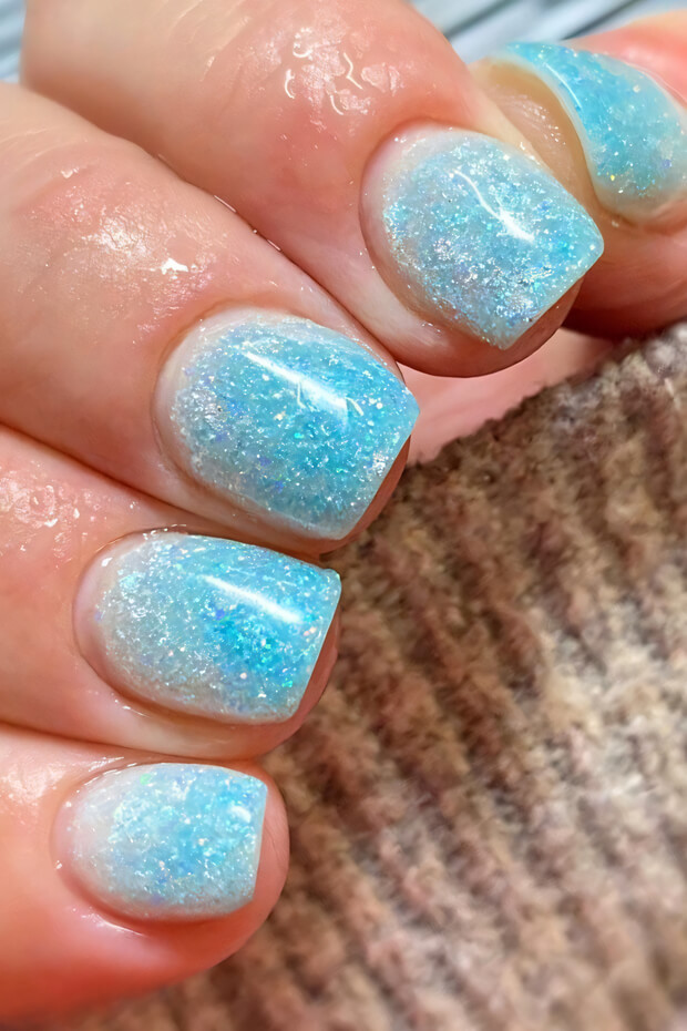 Light blue base with iridescent glitter gradient