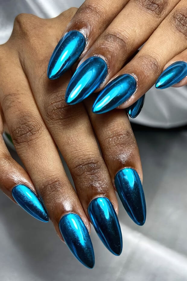 Metallic blue nails with shiny mirror-like finish