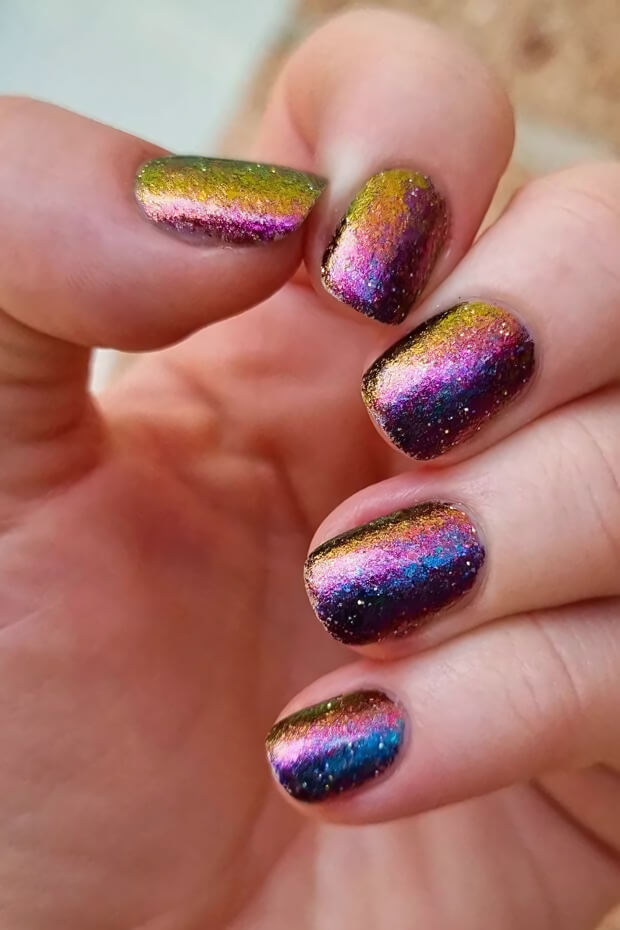 Multicolored holographic effect with shades of purple, blue, and green