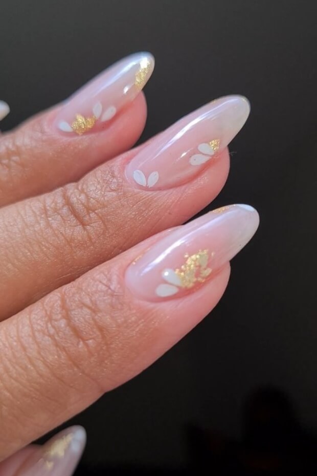Nude base coat with white and gold floral pattern