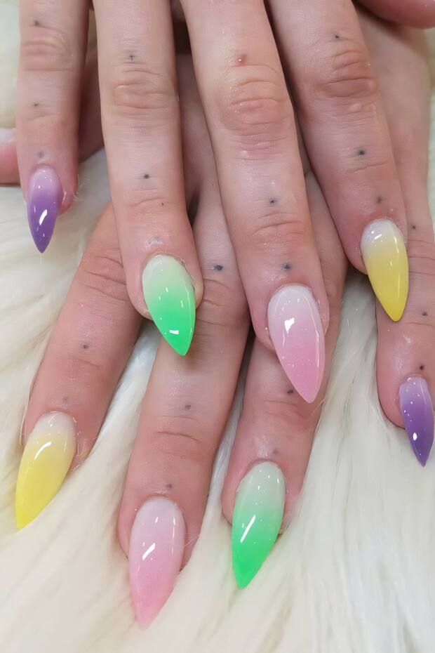 Gradient nails in pink, yellow, and green colors