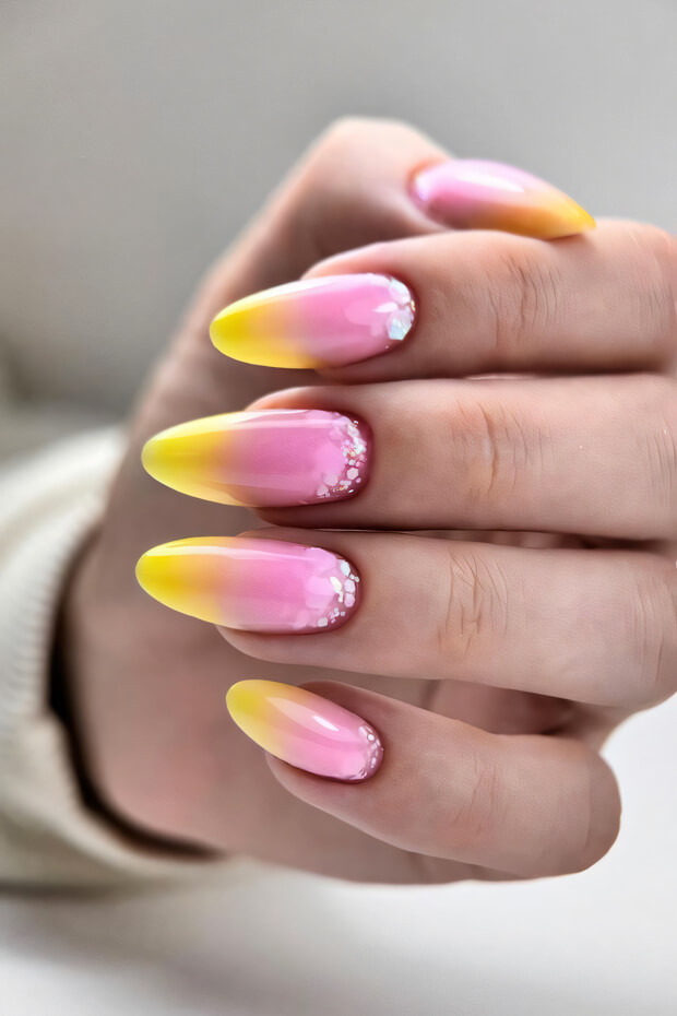 Pink and yellow ombre nails with white diamonds