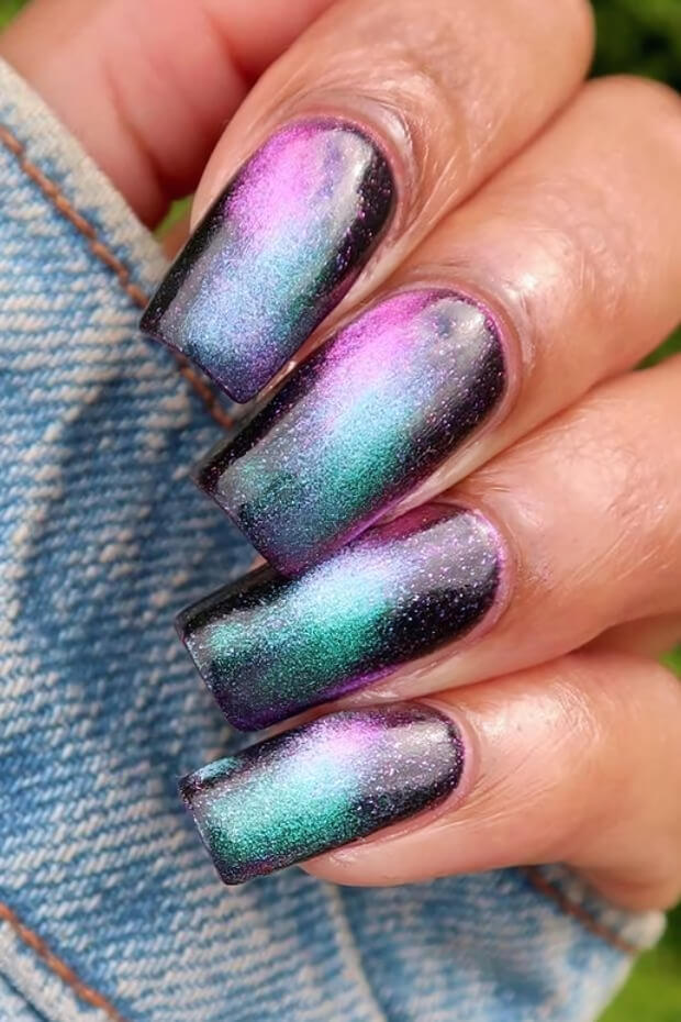 Purple and green holographic glitters on black background