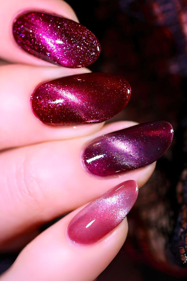Red and purple nails with glittery finish