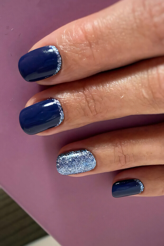Dark blue nails with silver glitters