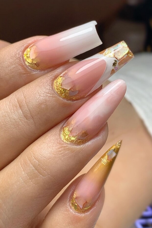 Gold leaf pattern on pink nails