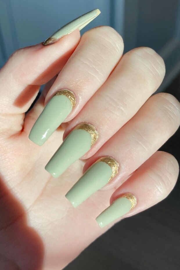 Green nails with gold accent