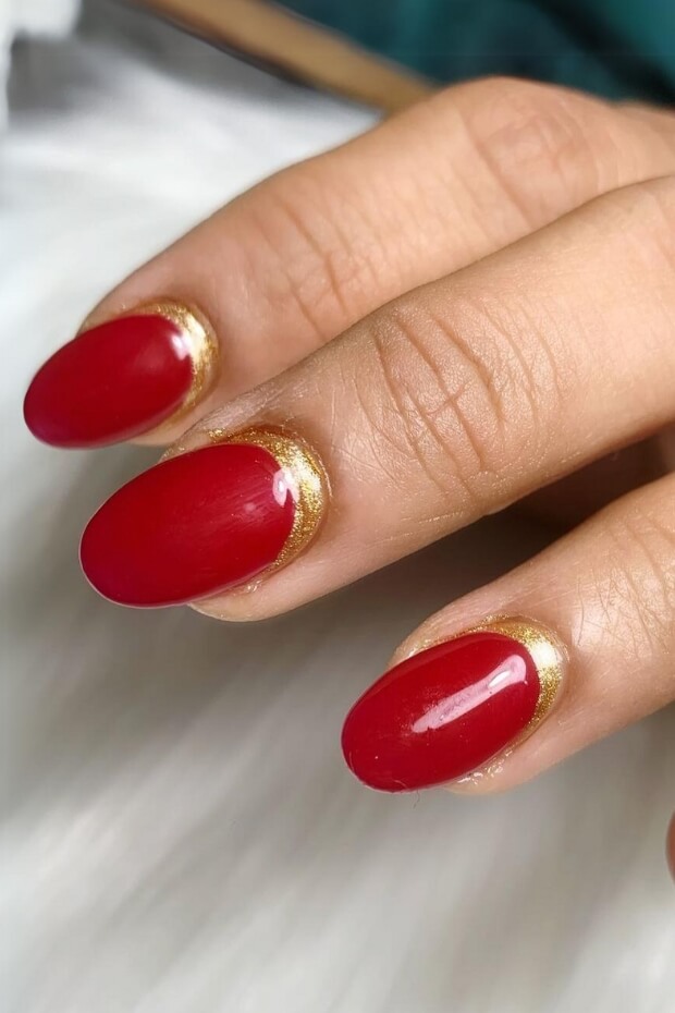 Red nails with gold accent
