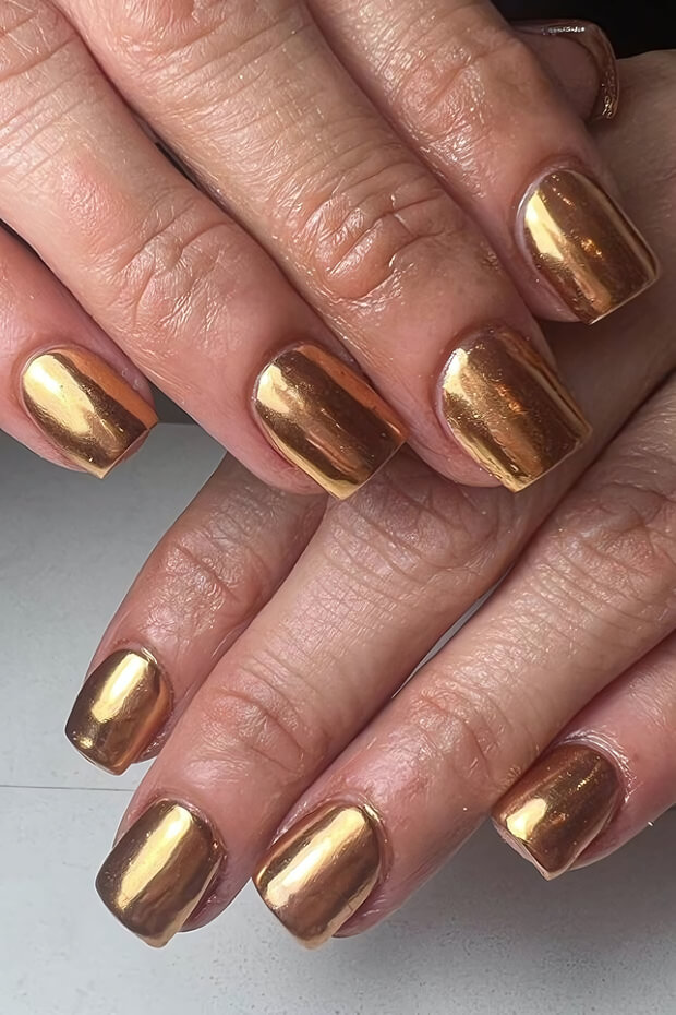 Sleek and sophisticated metallic gold nail design