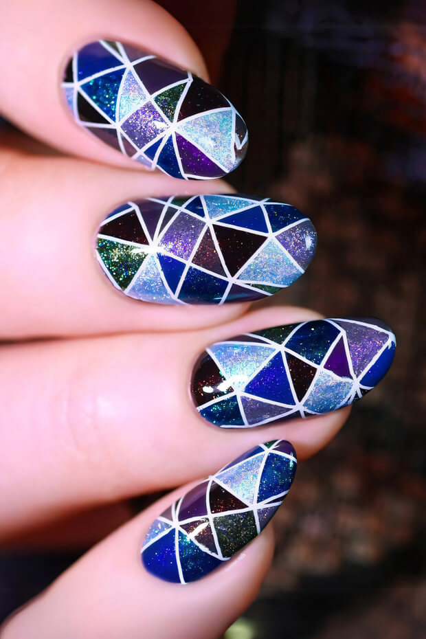 Sparkly geometric pattern with triangles in purple, blue, and silver
