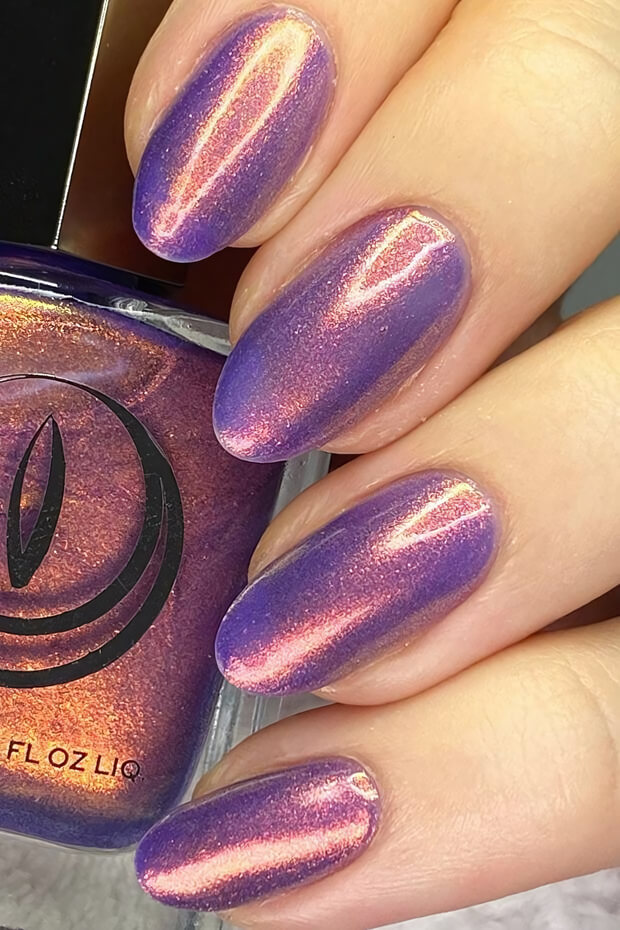 Unique chrome nail design with purple and pink hues