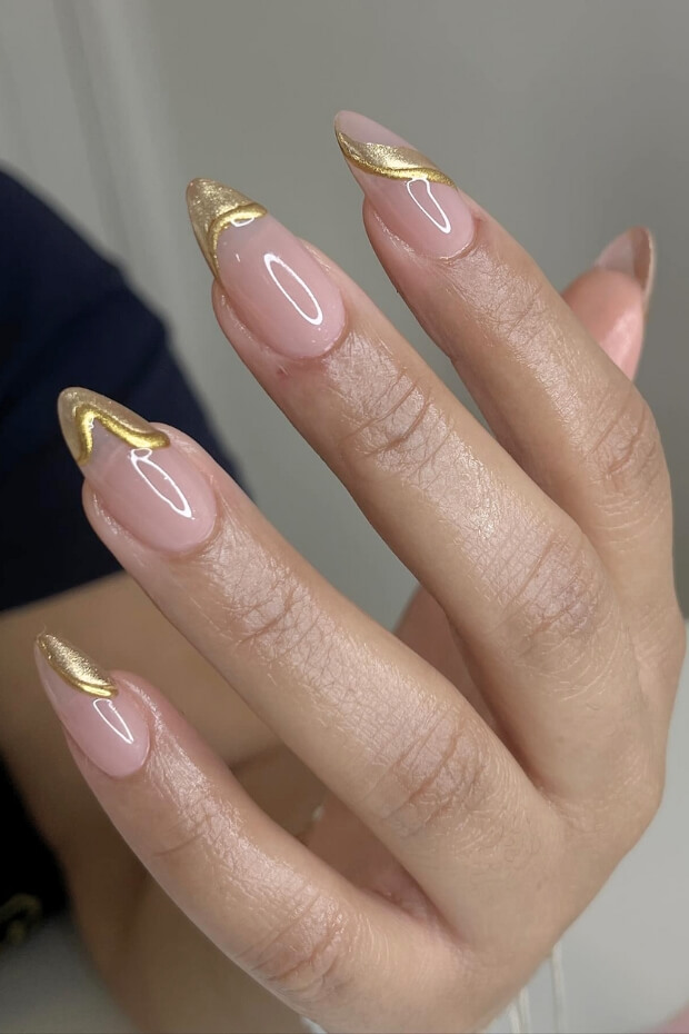 Unique and intricate gold accented nail art design