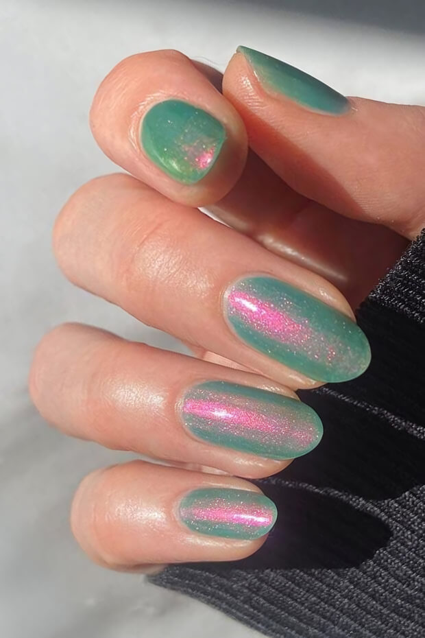 Unique green and pink holographic nail polish effect