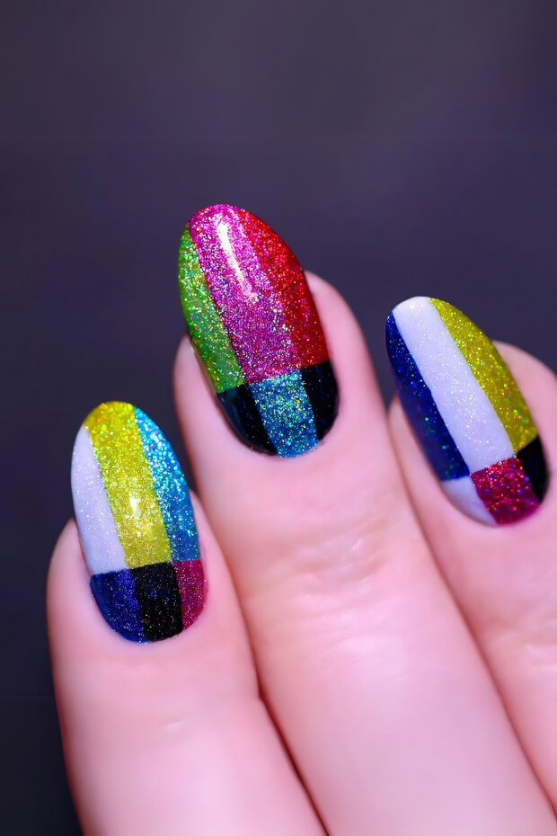 Colorful and vibrant nail design with various shapes