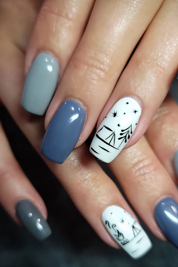Camping nails featuring gray and blue shades with tree and tent designs for outdoor enthusiasts.