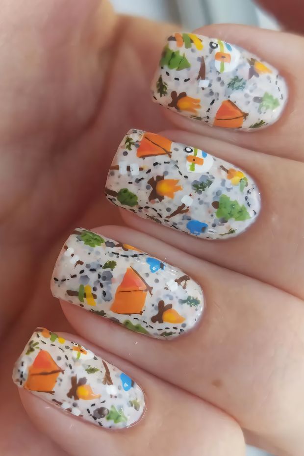 Camping nails with colorful tents and nature-inspired designs, perfect for outdoor lovers.