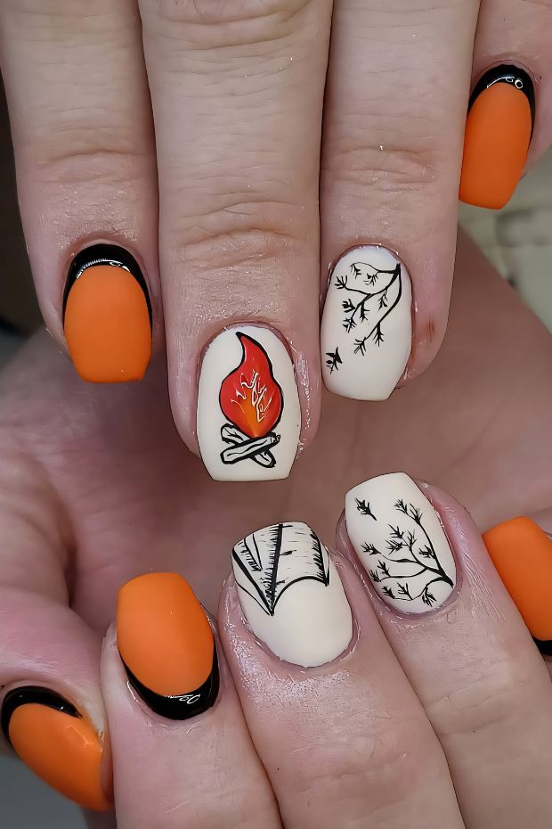 Camping nails featuring orange and cream colors with fire and nature designs, perfect for outdoor lovers and adventures.