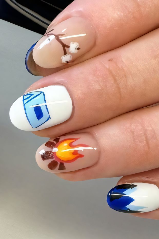 Camping nails featuring a tent, campfire, and marshmallows, inspired by outdoor adventures and nature themes.