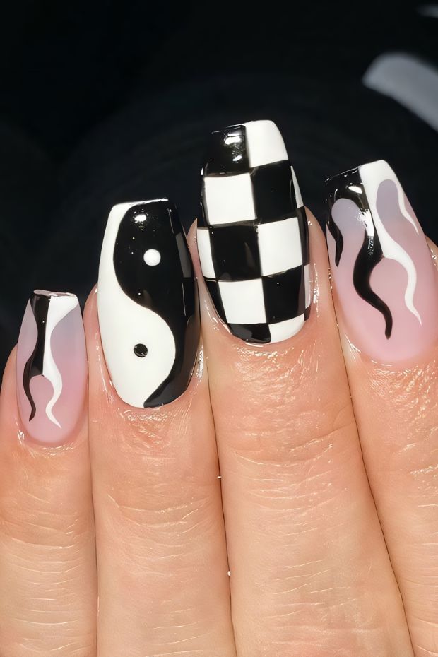 Creative black and white nail art with yin yang, checkerboard patterns, and flowing designs for a trendy look.