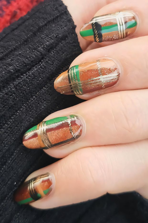 Winter geometric nail art design with brown, green, and gold accents for a trendy seasonal look.
