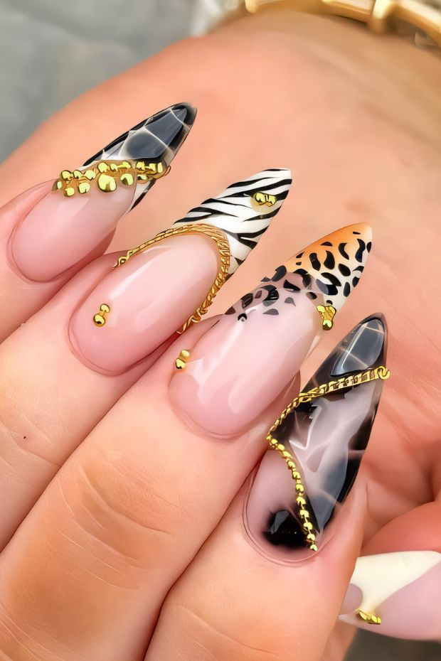 Stylish stiletto nails with animal prints, gold accents, and vibrant designs for a chic nail art look.