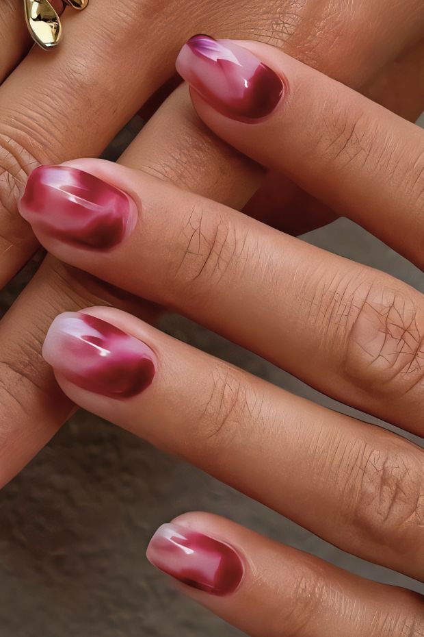 Ombre short nail design featuring burgundy and pink hues with a glossy finish, ideal for stylish nail art inspiration.