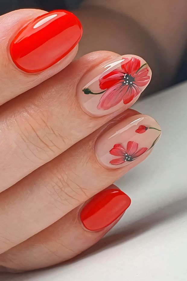 Stunning red floral nail design with glossy and matte finishes on natural nails.