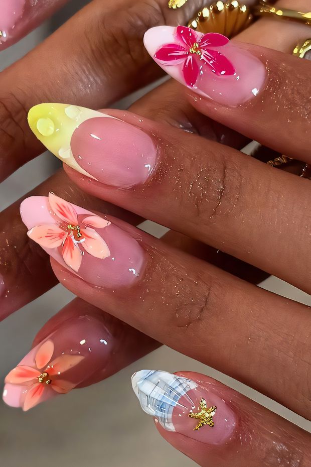 Colorful floral birthday nail design featuring pink, orange, and gold accents for a festive look.